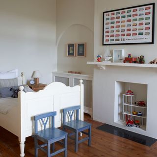 white childrens room with wooden floor and kid chairs