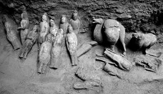 Archaeologists say that 105 items were discovered in the tomb and that most of them were figurines.