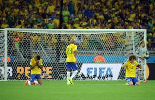 Brazil's players look dejected during their team's 7-1 defeat to Germany in the 2014 World Cup semi-finals.