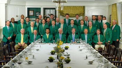 Attendees of the 2022 Masters Champions Dinner photographed behind the dinner table