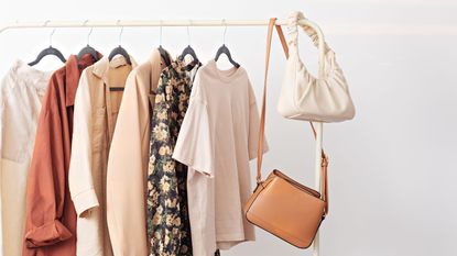 Purses hanging from a clothes rail