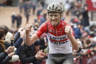 Tiesj Benoot (Lotto Soudal), caked in mud, wins the 2018 Strade Bianche