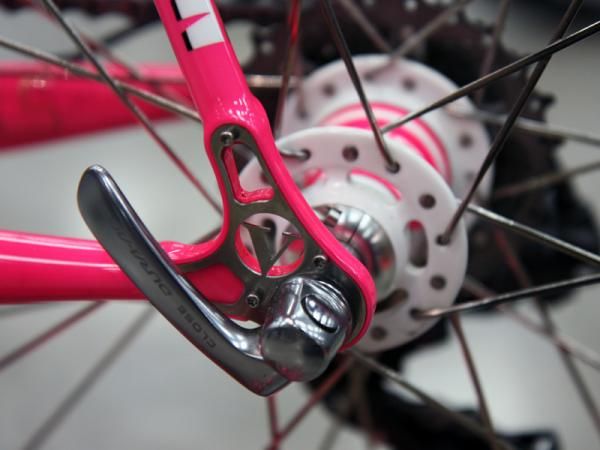 Stainless steel plates bolted into the dropouts of this Vanilla Workshop Speedvagen road bike protect the finish while also adding to the aesthetic.
