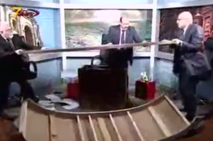 Cable news pundits destroy studio in on-air brawl