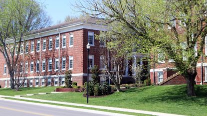 A building that serves as student housing, on a spring day.