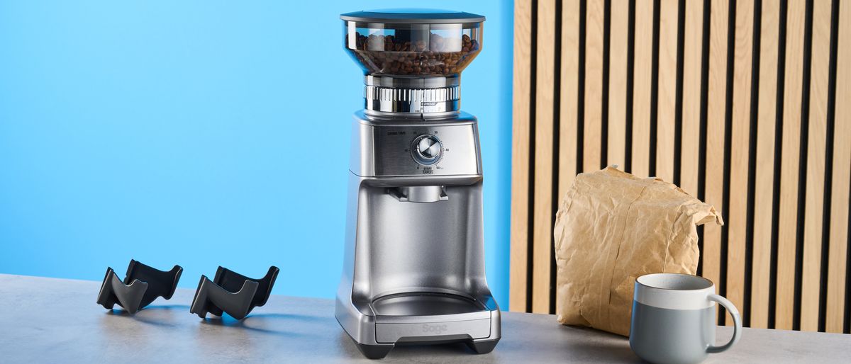 the breville dose control pro, called sage dose control pro in the uk, a silver coffee grinder with 60 grind settings and labeled grind size adjustment