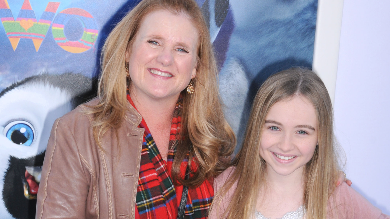 Actress Nancy Cartwright and daughter arrive at the Los Angeles premiere of &quot;Happy Feet Two&quot; held at Grauman&#039;s Chinese Theatre on November 13, 2011 in Hollywood, California