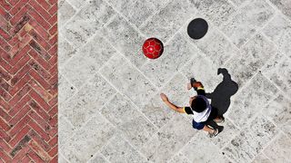 A boy chases a red ball in this aerial shot by Jean Fraipont in Chiusi, Italy.