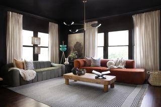 dark living room with statement lighting by Urbanology Designs