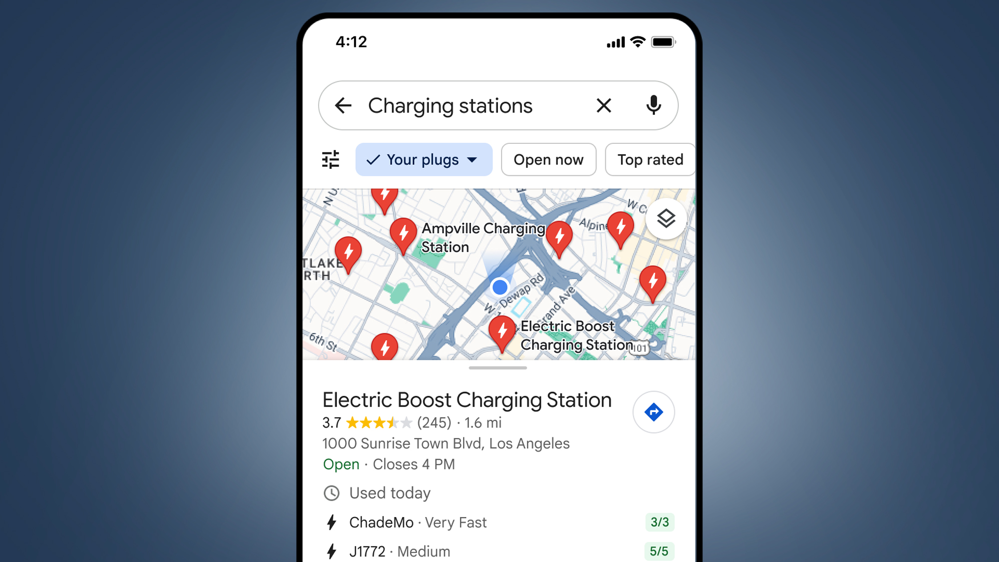 A phone on a blue background showing the Google Maps EV charging station info
