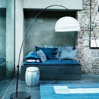 modern blue and white living room with exposed brick walls