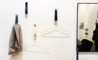 Clothing hanger wall straps.