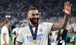 Karim Benzema celebrates winning a fifth Champions League for Real Madrid.