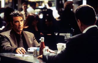 Al Pacino as Lieutenant Vincent Hanna sits at a diner in in Heat