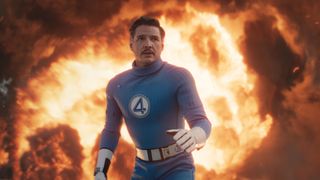 Reed Richards in an action stance with a fireball behind him in The Fantastic Four: First Steps