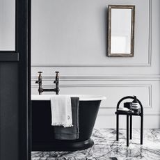 monochrome bathroom with black tub