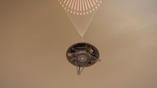 Artist's illustration showing a simulated view of NASA's InSight lander descending toward the surface of Mars under a parachute. InSight will touch down on the afternoon of Nov. 26, 2018.
