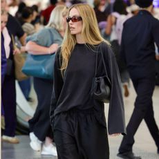 An image of Margot Robbie wearing one of the chicest celebrity airport outfits of 2026.
