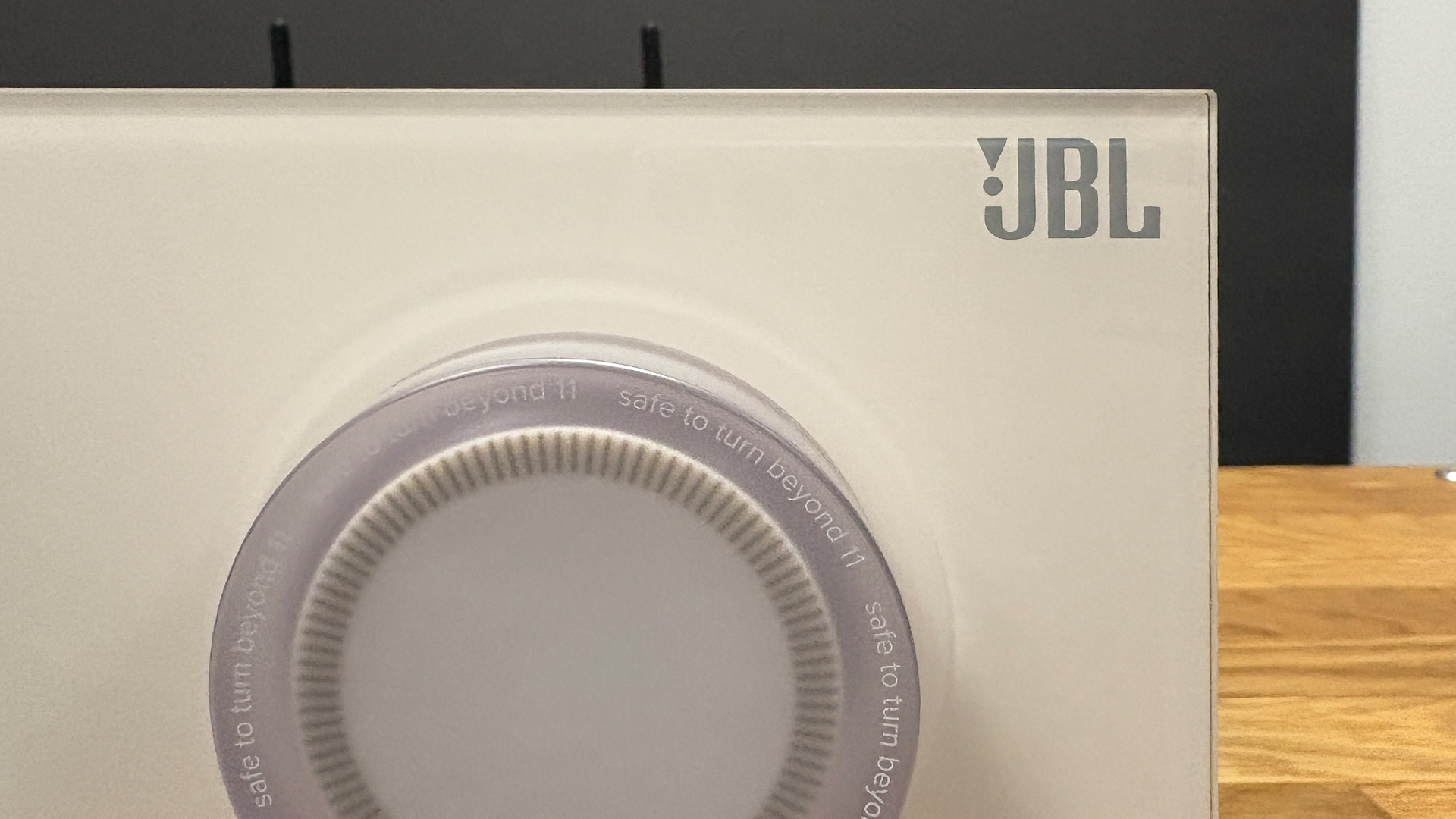 JBL MA7100HP AV receiver close up on volume dial and JBL logo