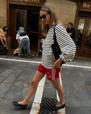 Tops to wear with shorts: @annelauremais wears a Breton top with shorts