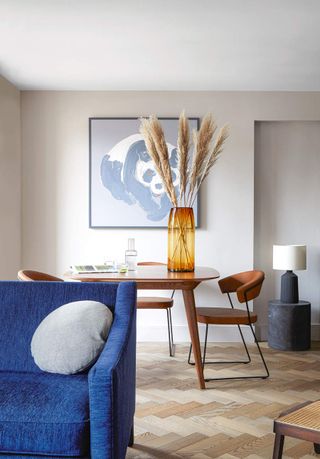 A dining table decorated with pampas grass