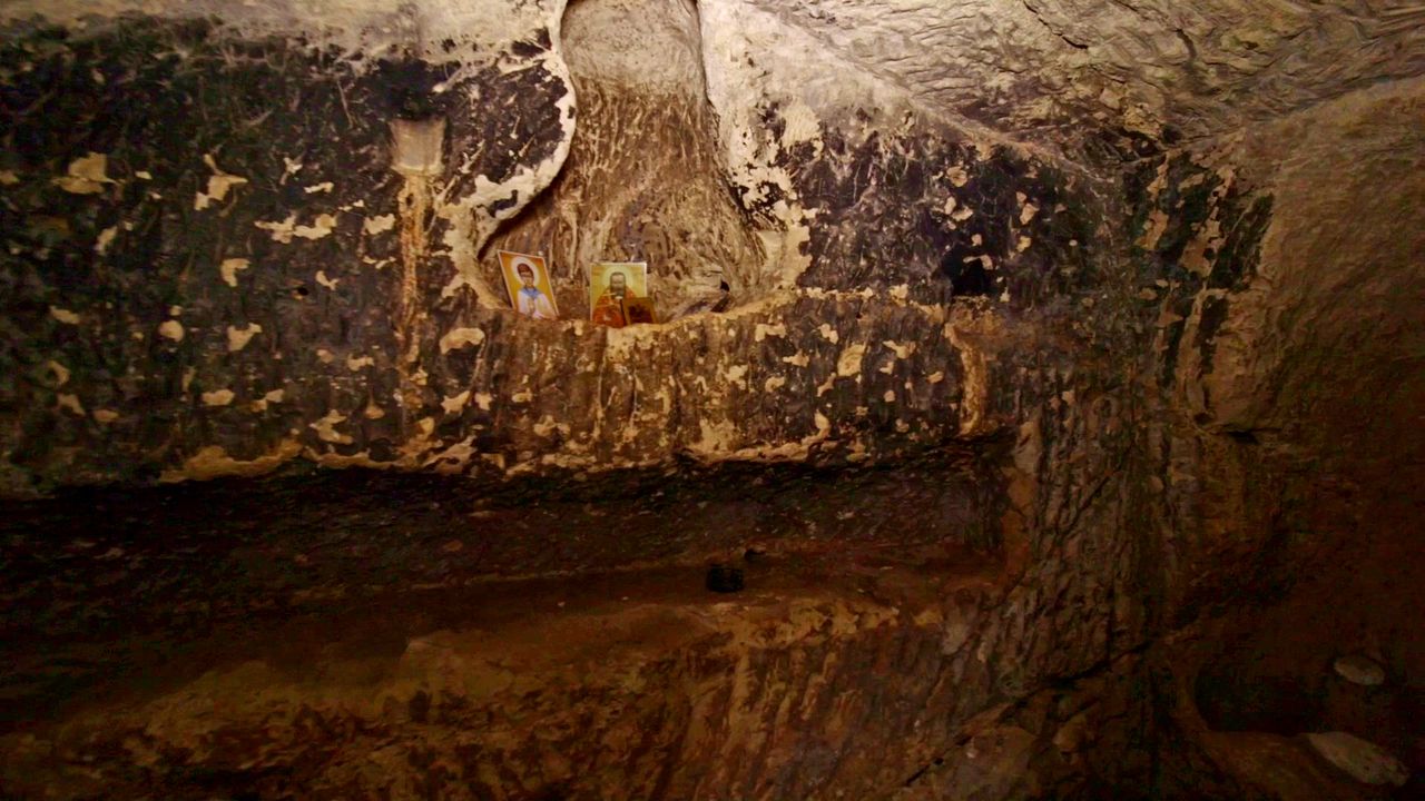 Close up of a wall inside Salome&rsquo;s cave which are inscribed with icons made by Christian worshippers.