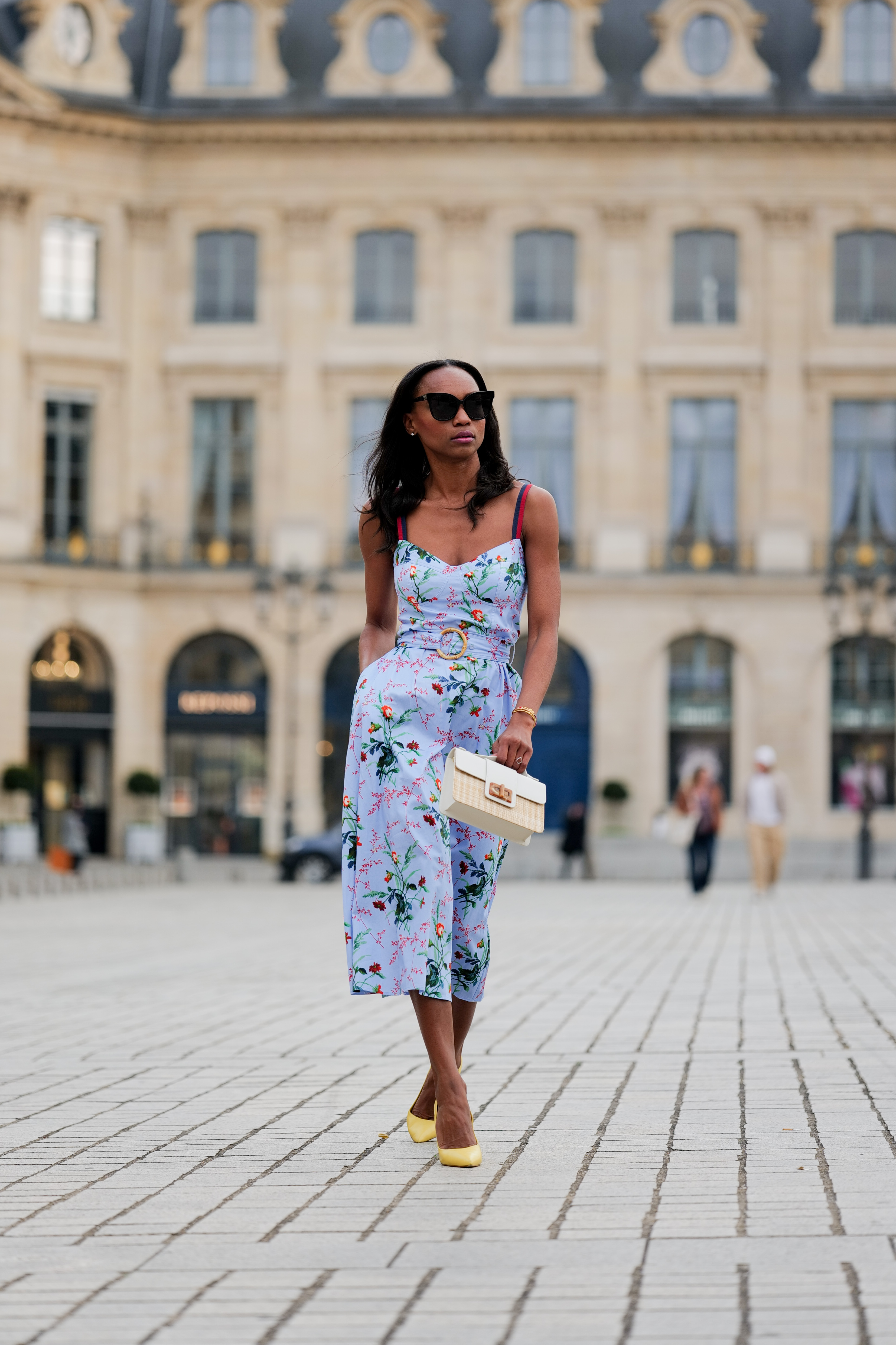woman wearing a blue floral dress
