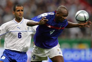 Patrick Vieira heads the ball away in a World Cup qualifier for France against Israel in 2004.