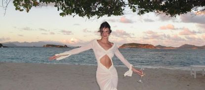 Kendall Jenner on the beach in a sheer white dress