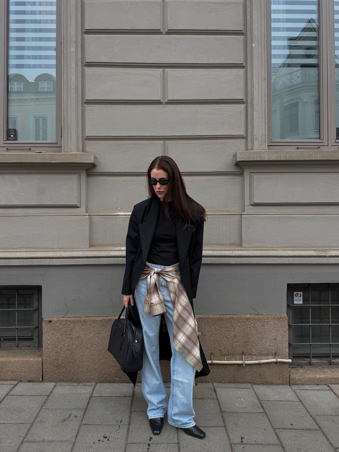 Influencer wearing straight-leg jeans and low-heel ankle boots