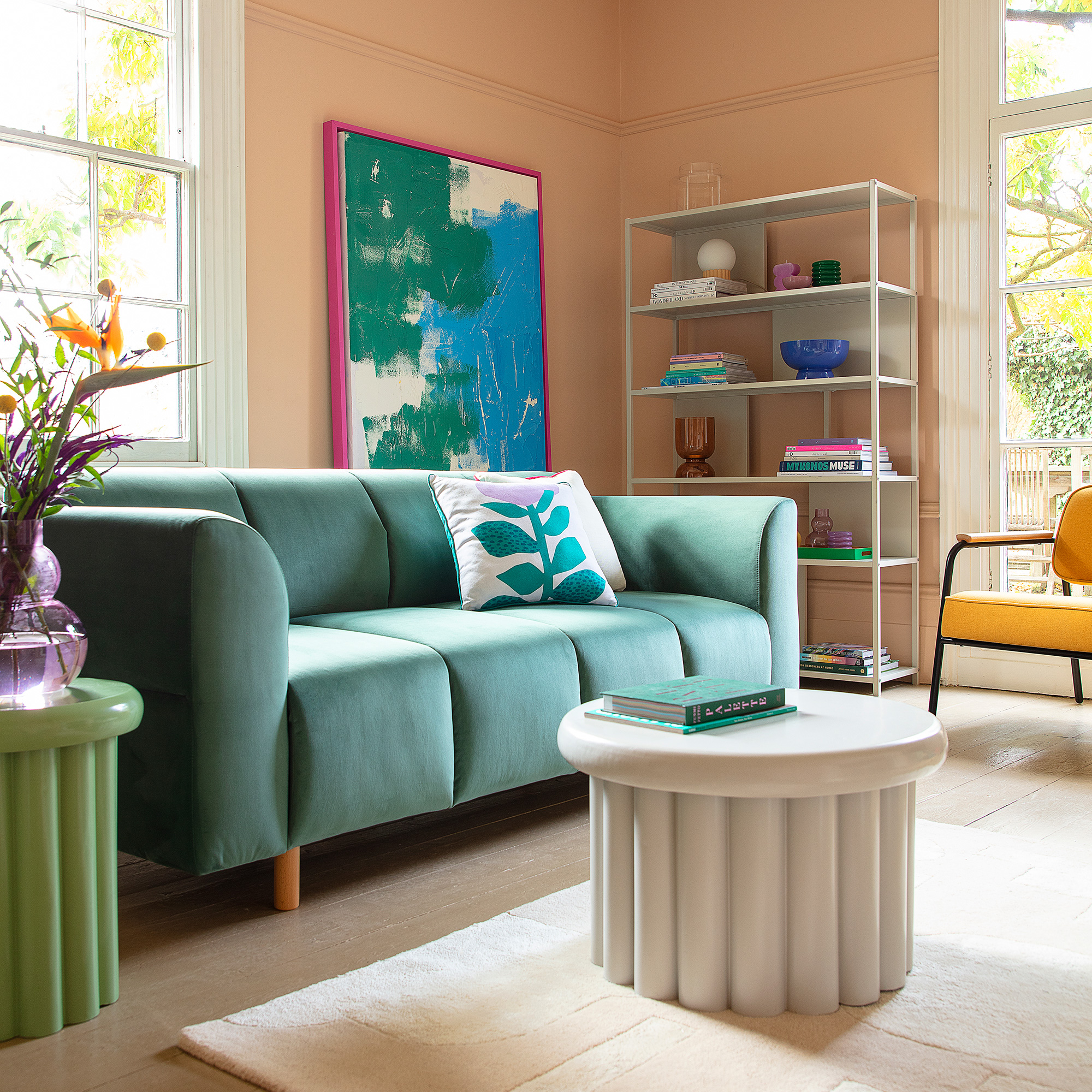 Green sofa and cushion with flower illustration