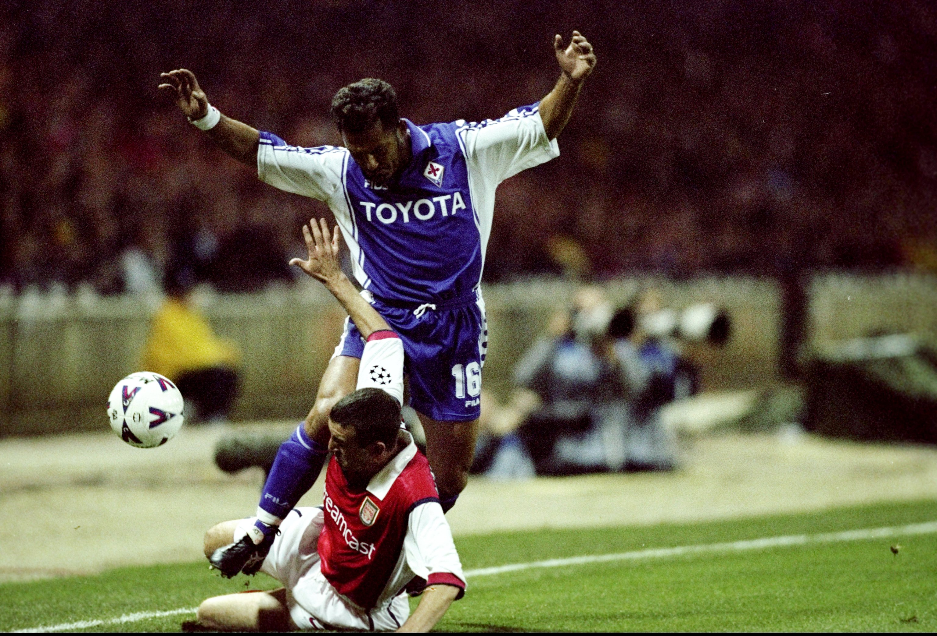 Fiorentina's Angelo Di Livio is tackled by Arsenal's Nigel Winterburn in a Champions League clash at Wembley in October 1999.