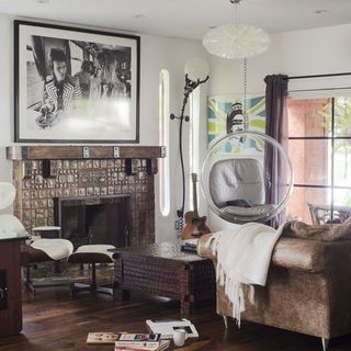 living room with white wall and iconic bubble chair