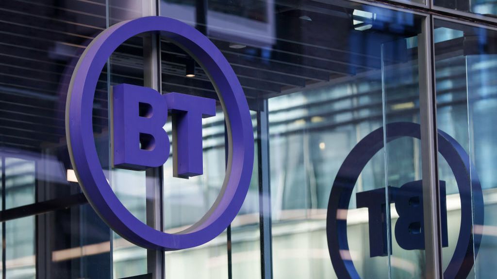 The BT logo displayed on the side of an office window