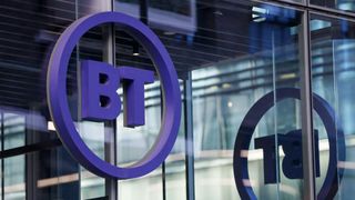 The BT logo displayed on the side of an office window