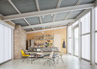 Inside the main living space, with the hand-built kitchen and re-used steel frame