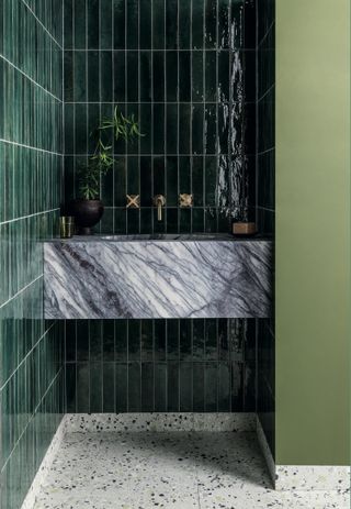 bathroom with glazed dark green tiles