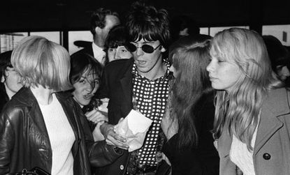 Keith Richards is mobbed by fans at at a London Airport in the summer of 1966.