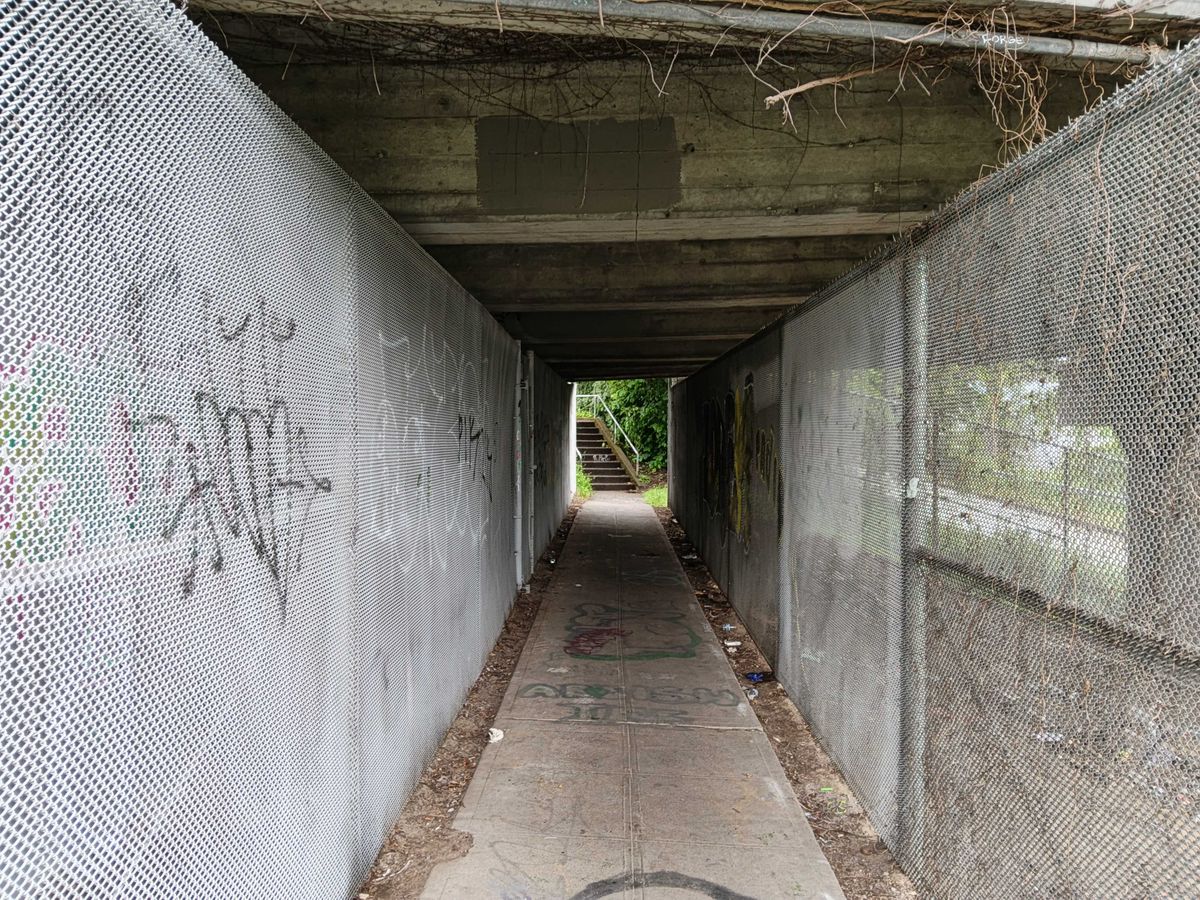 A tunnel with gates on either side
