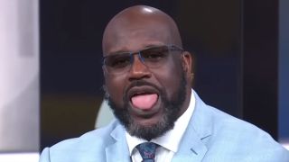 Shaq in a blue suit with his tongue sticking out during Inside the NBA on TNT