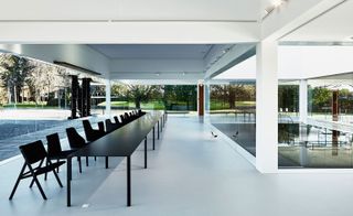 line-up of Molteni chairs stand pround alongside Jean Nouvel's