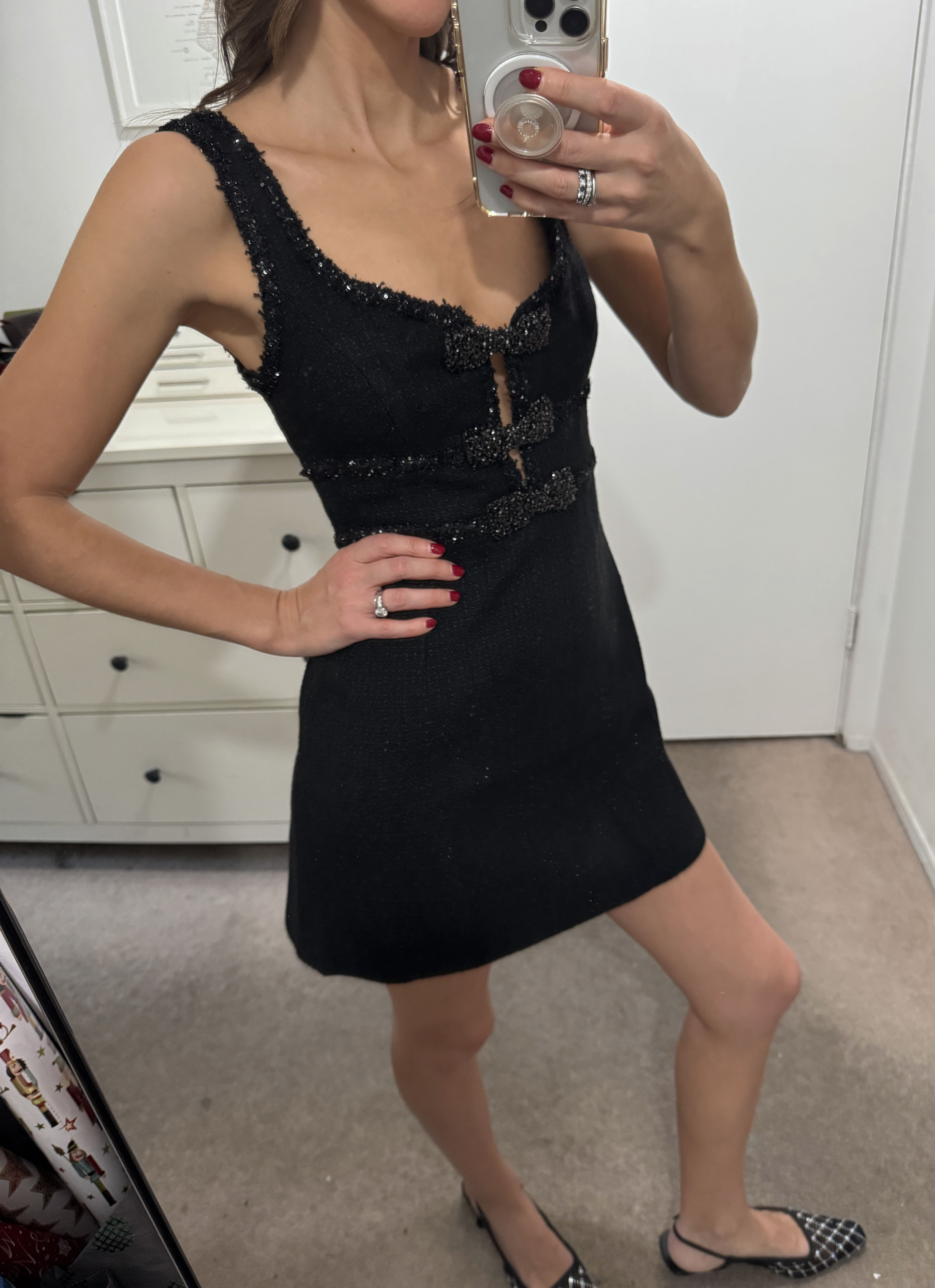 Woman in black tweed party dress