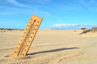 Thermometer on beach