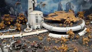 A Tau army defends a white sci-fi structure