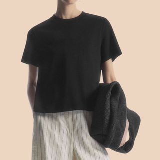 Flat lay image of woman wearing black t-shirt