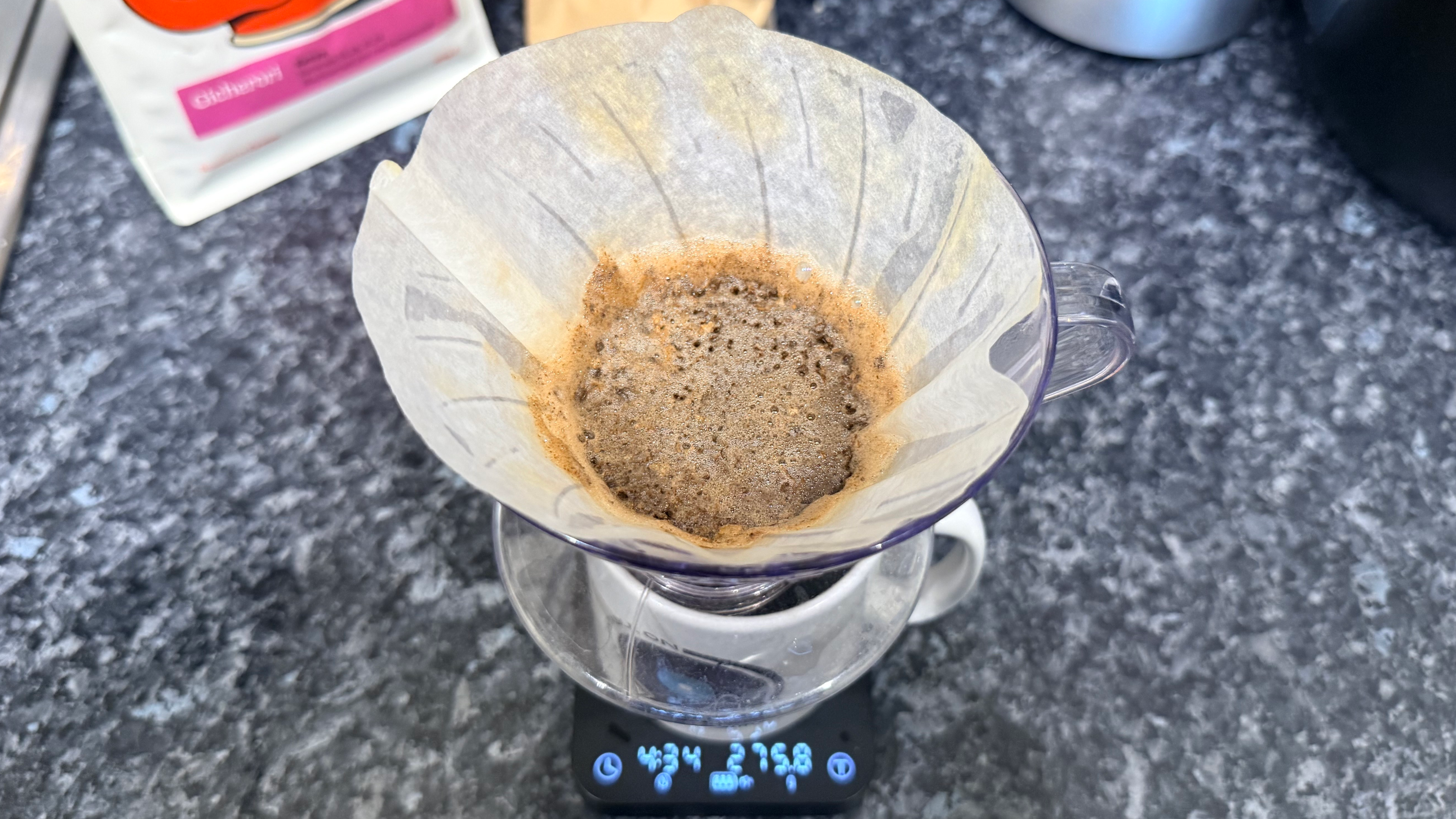 a photo of pour-over coffee made on the hario v60 dripper photographed with the wacaco exagram pro coffee scale