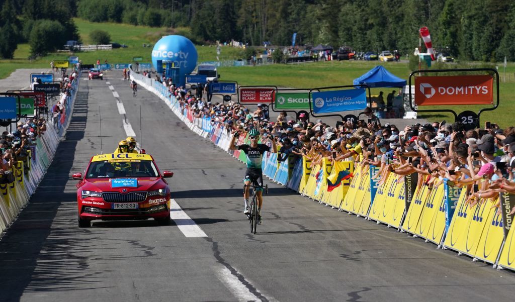 Team Bora rider Germanys Lennard Kamna celebrates as he crosses the finish line at the end of the fourth stage of the 72nd edition of the Criterium du Dauphine cycling race 153 km between Ugine and Megeve on August 15 2020 Photo by EDDY LEMAISTRE POOL AFP Photo by EDDY LEMAISTREPOOLAFP via Getty Images