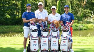 Wyndham Clark (far left), Scottie Scheffler (left), Collin Morikawa (right), and Xander Schauffele (far right) smile in their Team USA Olympic golf gear