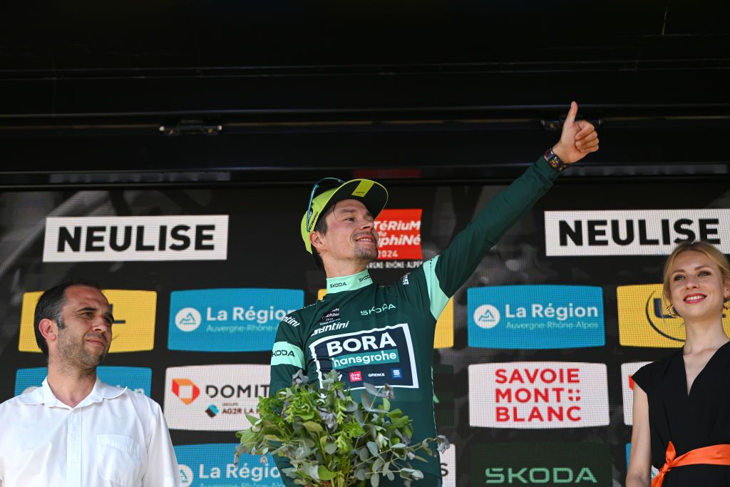 NEULISE FRANCE JUNE 05 Primoz Roglic of Slovenia and Team BORA hansgrohe celebrates at podium as Green Points Jersey winner during the 76th Criterium du Dauphine 2024 Stage 4 a 344km individual time trial at stage from SaintGermainLaval to Neulise 552m UCIWT on June 05 2024 in Neulise France Photo by Dario BelingheriGetty Images