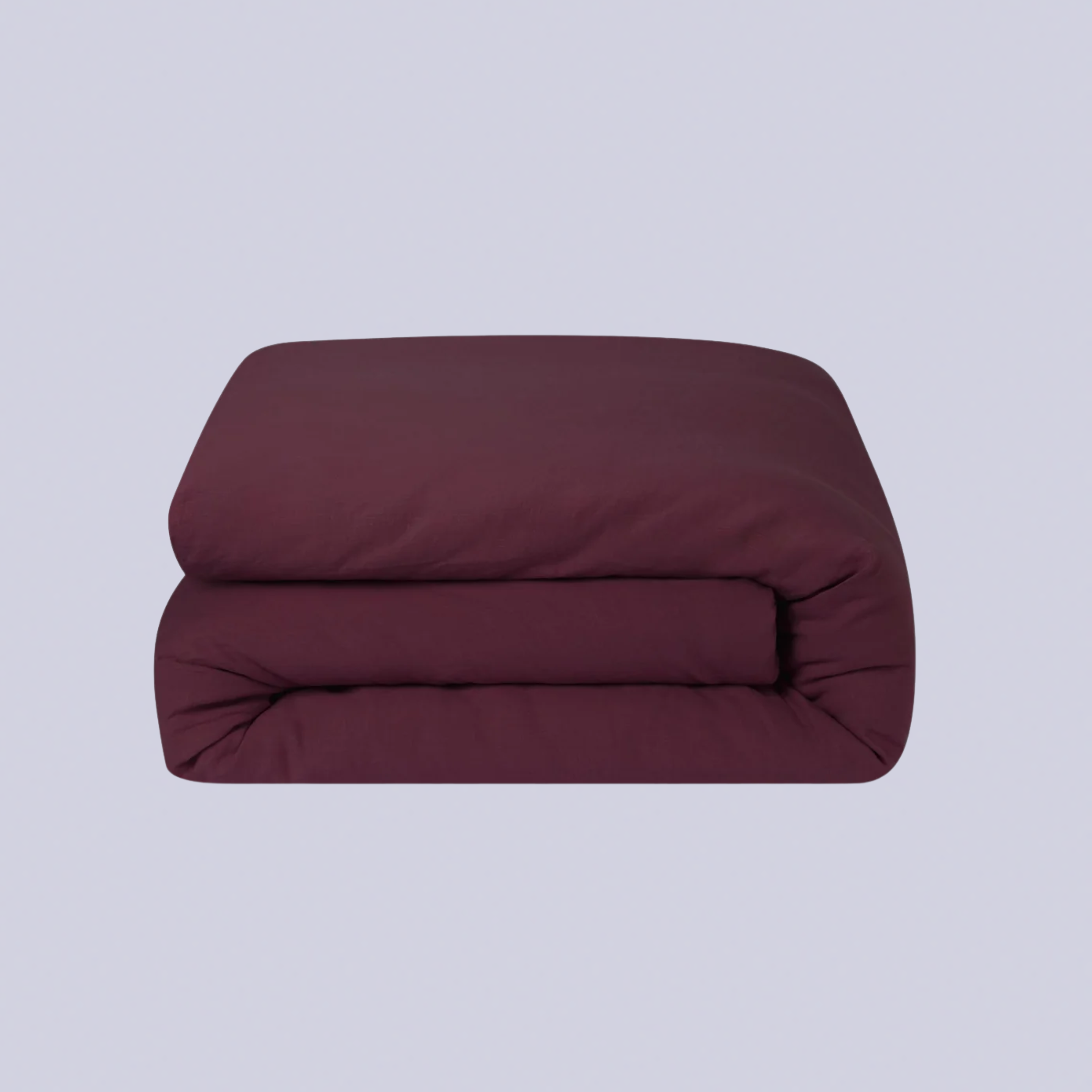 A plum colored folded bedding set